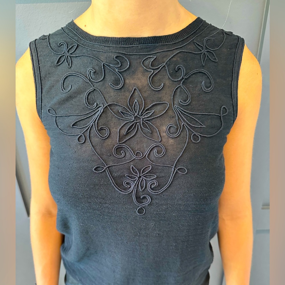 Black sleeveless knit top with embroidery